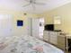 Main bedroom with a dresser and comfortable bed, featuring beach-themed decor at 426 Bouchelle Dr # 303, New Smyrna Beach, FL 32169