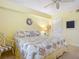 Relaxing bedroom with a queen-size bed and beach-themed bedding at 426 Bouchelle Dr # 303, New Smyrna Beach, FL 32169