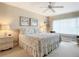 Spacious bedroom with king bed and large window at 426 Bouchelle Dr # 303, New Smyrna Beach, FL 32169