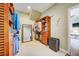 Large walk-in closet with ample shelving and drawers at 300 Quay Assisi Ct, New Smyrna Beach, FL 32169