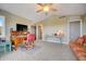 Bright home office features built-in desk, comfy seating, and large window at 300 Quay Assisi Ct, New Smyrna Beach, FL 32169