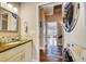 Main floor bathroom with laundry and access to other rooms at 300 Quay Assisi Ct, New Smyrna Beach, FL 32169