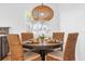 Bright dining area with a round table and woven chairs, offering a casual and comfortable space at 1456 N Grandview Ave, Daytona Beach, FL 32118