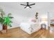Bedroom with a queen bed, ceiling fan, and hardwood floors at 1456 N Grandview Ave, Daytona Beach, FL 32118