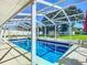 Refreshing screened pool perfect for enjoying the Florida sun at 813 E 13Th Ave, New Smyrna Beach, FL 32169