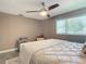 Main bedroom with a queen bed and ceiling fan at 813 E 13Th Ave, New Smyrna Beach, FL 32169