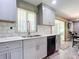 Updated kitchen with gray cabinets, stainless steel appliances, and quartz countertops at 813 E 13Th Ave, New Smyrna Beach, FL 32169