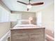 Charming bedroom with a queen-size bed and ceiling fan at 813 E 13Th Ave, New Smyrna Beach, FL 32169