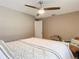 Main bedroom with a queen bed and ceiling fan at 813 E 13Th Ave, New Smyrna Beach, FL 32169