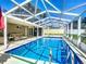 Inviting screened pool with plenty of space for relaxation at 813 E 13Th Ave, New Smyrna Beach, FL 32169