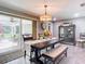Bright dining room with table, bench, and view to patio at 813 E 13Th Ave, New Smyrna Beach, FL 32169