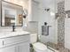 Updated bathroom with a walk-in shower and modern vanity at 813 E 13Th Ave, New Smyrna Beach, FL 32169
