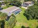 Aerial view showing home, pool, and surrounding neighborhood at 813 E 13Th Ave, New Smyrna Beach, FL 32169