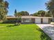 Charming ranch home with a two-car garage and well-manicured lawn at 813 E 13Th Ave, New Smyrna Beach, FL 32169