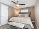 Comfortable bedroom with a king-size bed and ceiling fan at 813 E 13Th Ave, New Smyrna Beach, FL 32169