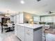 Modern kitchen boasts a large island and white shaker cabinets at 813 E 13Th Ave, New Smyrna Beach, FL 32169
