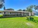 One-story ranch home with a spacious yard and attractive landscaping at 813 E 13Th Ave, New Smyrna Beach, FL 32169