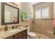 Well-appointed bathroom with granite vanity, shower, and decorative artwork at 728 Sea Duck Dr, Daytona Beach, FL 32119
