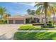 Two-story home with three car garage and landscaped yard at 728 Sea Duck Dr, Daytona Beach, FL 32119