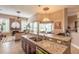 Spacious kitchen with granite countertops, stainless steel appliances, and an island at 728 Sea Duck Dr, Daytona Beach, FL 32119
