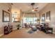Relaxing living room with comfortable seating, a ceiling fan, and large windows at 728 Sea Duck Dr, Daytona Beach, FL 32119