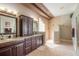 Luxurious bathroom featuring double vanities, granite countertops, and a large walk-in shower at 728 Sea Duck Dr, Daytona Beach, FL 32119