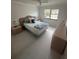 Guest bedroom with full-size bed and light wood furniture at 840 Center Ave # 840, Daytona Beach, FL 32117