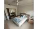 Bright bedroom with mirrored closet doors and comfortable bed at 840 Center Ave # 840, Daytona Beach, FL 32117