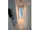Long hallway with light wood flooring and access to bedrooms at 840 Center Ave # 840, Daytona Beach, FL 32117