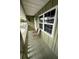 Private balcony with seating and views of the neighborhood at 840 Center Ave # 840, Daytona Beach, FL 32117