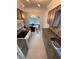 Open concept kitchen and dining area with modern light fixtures at 840 Center Ave # 840, Daytona Beach, FL 32117