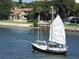 Sailboat on waterway near waterfront homes at 11 Andrea Dr, New Smyrna Beach, FL 32168