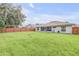 Large backyard with fenced yard and lush grass at 1768 Creekwater Blvd, Port Orange, FL 32128