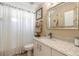 Clean bathroom with a shower/tub combo and updated vanity at 5452 Saint Regis Way, Port Orange, FL 32128