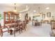 Open concept dining room flows into living room with neutral color palette at 5452 Saint Regis Way, Port Orange, FL 32128