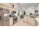 Open concept kitchen with stainless steel appliances and granite countertops at 5452 Saint Regis Way, Port Orange, FL 32128