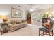 Relaxing sunroom with comfortable seating and built-in shelving at 5452 Saint Regis Way, Port Orange, FL 32128