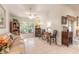Bright sunroom features a cozy seating area and a view of the backyard at 5452 Saint Regis Way, Port Orange, FL 32128
