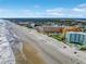 Aerial showcasing beachfront homes and ocean at 701 N Atlantic Ave # 202, New Smyrna Beach, FL 32169
