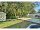 Backyard oasis with a deck, shed and mature tree at 1004 W 7Th St, New Smyrna Beach, FL 32168