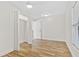 Spacious bedroom with laminate flooring, a ceiling fan, and ample closet space at 1004 W 7Th St, New Smyrna Beach, FL 32168