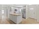 Bright kitchen featuring white cabinets and a butcher block island at 1004 W 7Th St, New Smyrna Beach, FL 32168