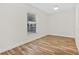 Well-lit bedroom with laminate wood floors and a ceiling fan at 1004 W 7Th St, New Smyrna Beach, FL 32168