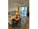 Comfortable living room featuring a sectional sofa and large windows at 721 S Beach St # 214A, Daytona Beach, FL 32114