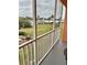 Balcony with water view and screened enclosure at 721 S Beach St # 214A, Daytona Beach, FL 32114
