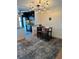 Bright dining area with a unique light fixture and seating for four at 721 S Beach St # 214A, Daytona Beach, FL 32114