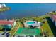 Aerial view of waterfront community with pool, tennis court, and boat slips at 721 S Beach St # 214A, Daytona Beach, FL 32114
