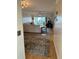 Living room with hardwood floor, couch, and sliding door access to patio at 721 S Beach St # 214A, Daytona Beach, FL 32114