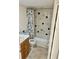 Clean bathroom with shower/tub combo, toilet and vanity at 721 S Beach St # 214A, Daytona Beach, FL 32114