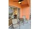 Small balcony with table and chairs at 721 S Beach St # 214A, Daytona Beach, FL 32114